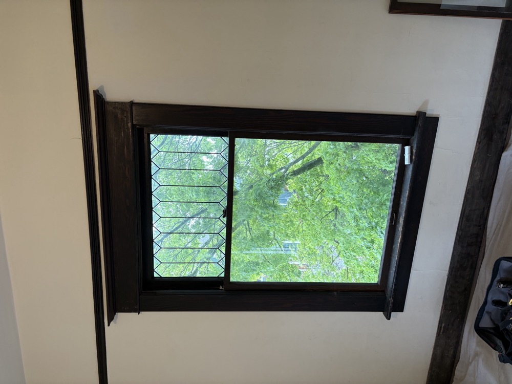 Double-hung window restoration detail work